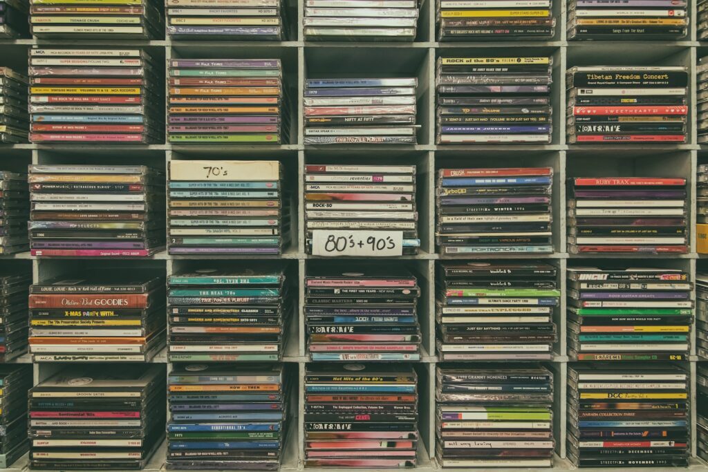 assorted books on black wooden shelf